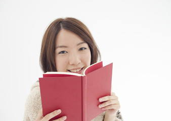 Young woman reading book