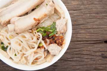 Vietnamese beef soup pho on a wooden background