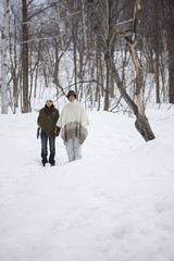 Fototapeta na wymiar Couple standing on snow