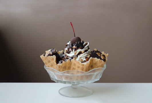 Ice Cream Sundae In An Edible Waffle Bowl With Brownies, Almonds