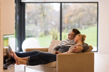 Young couple  in front of fireplace