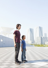 Father and son standing