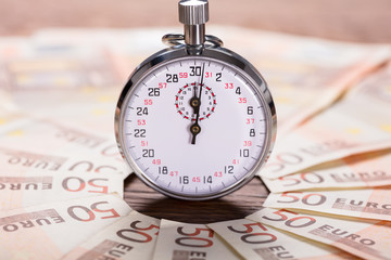 Stopwatch Between The Banknote