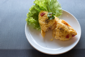 omelet with tomato and onion on the table.