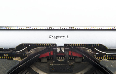 Chapter One typed. Vintage typewriter. Copyspace.