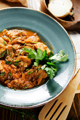 Chakhokhbili. Stewed poultry meat in tomato sauce with spices and garlic