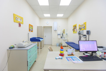 A pediatrician's office in a blue and white interior.