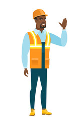 Young african-american builder waving his hand.
