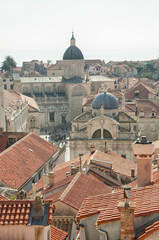 Fototapeta na wymiar Dubrovnik, a city in Croatia, with a view of the rooftops from the wall which surrounds it.