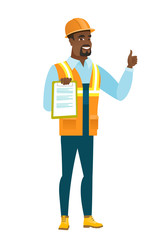 Builder with clipboard giving thumb up.