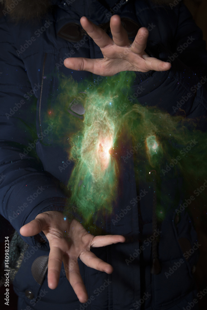 Wall mural the vast universe in the hands of a child. elements of this image furnished by nasa.