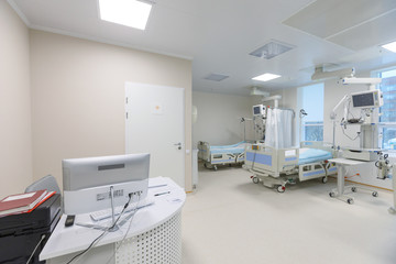 Modern equipped hospital room with two empty beds