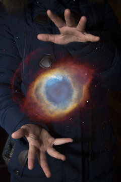 The vast universe in the hands of a child. Elements of this image furnished by NASA.