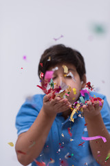 Fototapeta premium kid blowing confetti