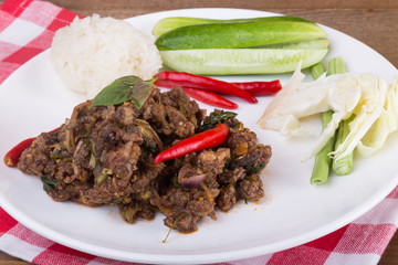 Spicy Thai minced beef salad with sticky rice