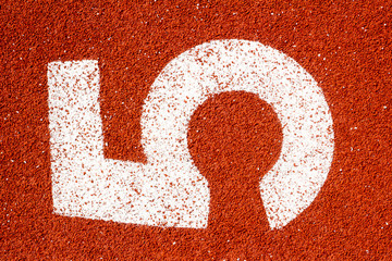 Number five on the start of a running track - check my portfolio for other numbers