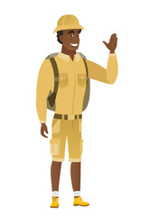 Young african-american traveler waving his hand.