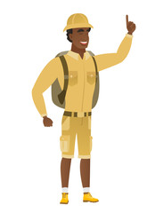 African traveler pointing with his forefinger.