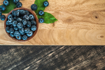 blueberries on wooden background, Freshly blueberries in wooden bowl. Juicy and fresh blueberries. Blueberry antioxidant. Concept for healthy eating and nutrition