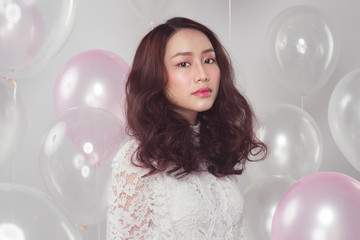 Stylish fashion asian woman with pastel balloons