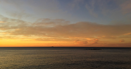 Naklejka na ściany i meble Sunset sky and horizon over ocean