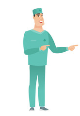 Young caucasian doctor pointing to the side.