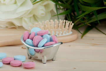Bath Time color tablets for kids on wood background 