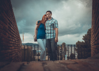Fototapeta premium Loving couple in traveling - Montjuic Barcelona