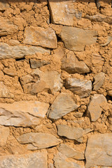 background of wall built by rocks and mud, treditional nepali house