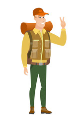 Caucasian traveler showing victory gesture.