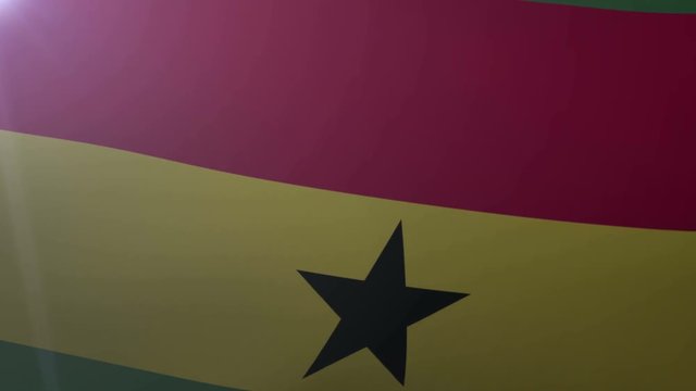 Flag of Ghana waving on flagpole in the wind, national symbol of freedom