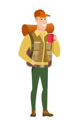 Obraz na płótnie Canvas Caucasian traveler holding cup of coffee.