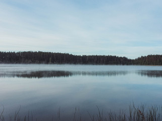 Fototapeta premium Morning fog on the lake, sunrise shot
