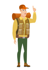 Traveler with open mouth pointing finger up.