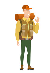 Smiling traveler showing ok sign.