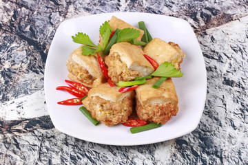 Fried gold bar as spicy fried tofu wrap minced pork .