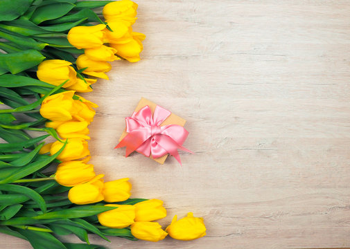 box gift bright yellow tulips on wood background, copy space for text. The concept of love, spring, tenderness, Tulip - Powered by Adobe