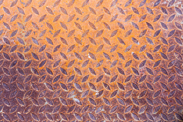 Surfaces metal floor sheet with rust.