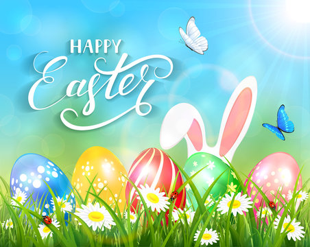 Happy Easter on blue background with bunny and eggs