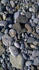 Pebbles on the sea shore. Vertical view