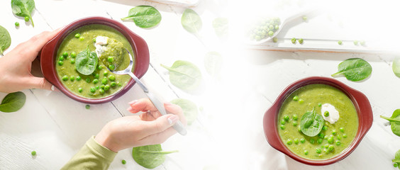 Woman hands with Bowl of healthy green pea soup.