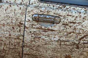 splashes of mud on off-road car