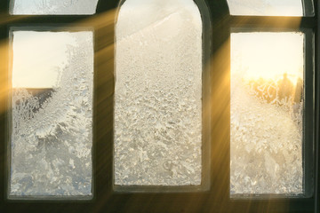 window in hoarfrost in sunlight