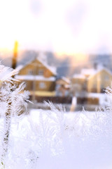 window in hoarfrost in sunlight