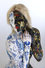 body art young beautiful girl in style hohloma