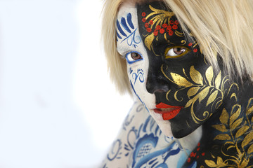 body art young beautiful girl in style hohloma