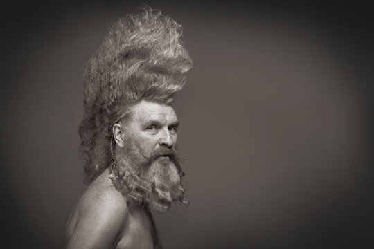 adult man with a beard and a high mohawk