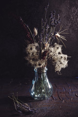 Still life with bouquet of dried flowers and herbs