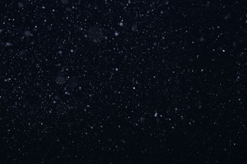 Fototapeta na wymiar snow on a black background
