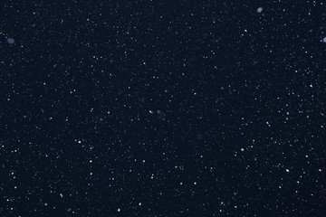 snow on a black background